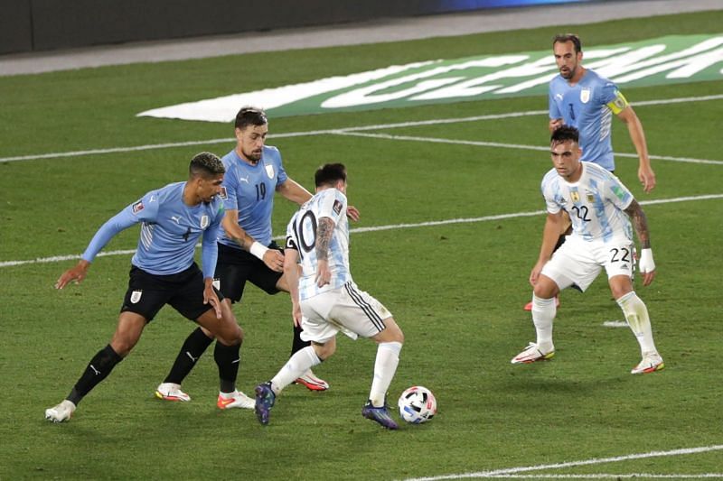 Uruguay were shambolic defensively against Argentina. Lionel Messi celebrates scoring Argentina's opener.